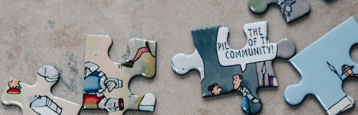 puzzle pieces and one says community