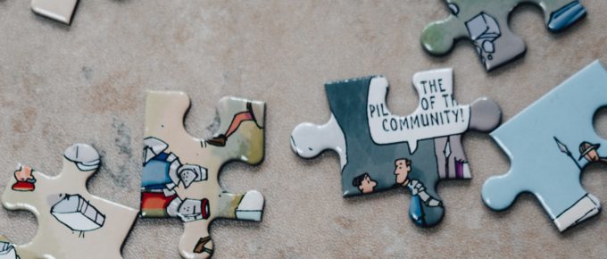 puzzle pieces and one says community
